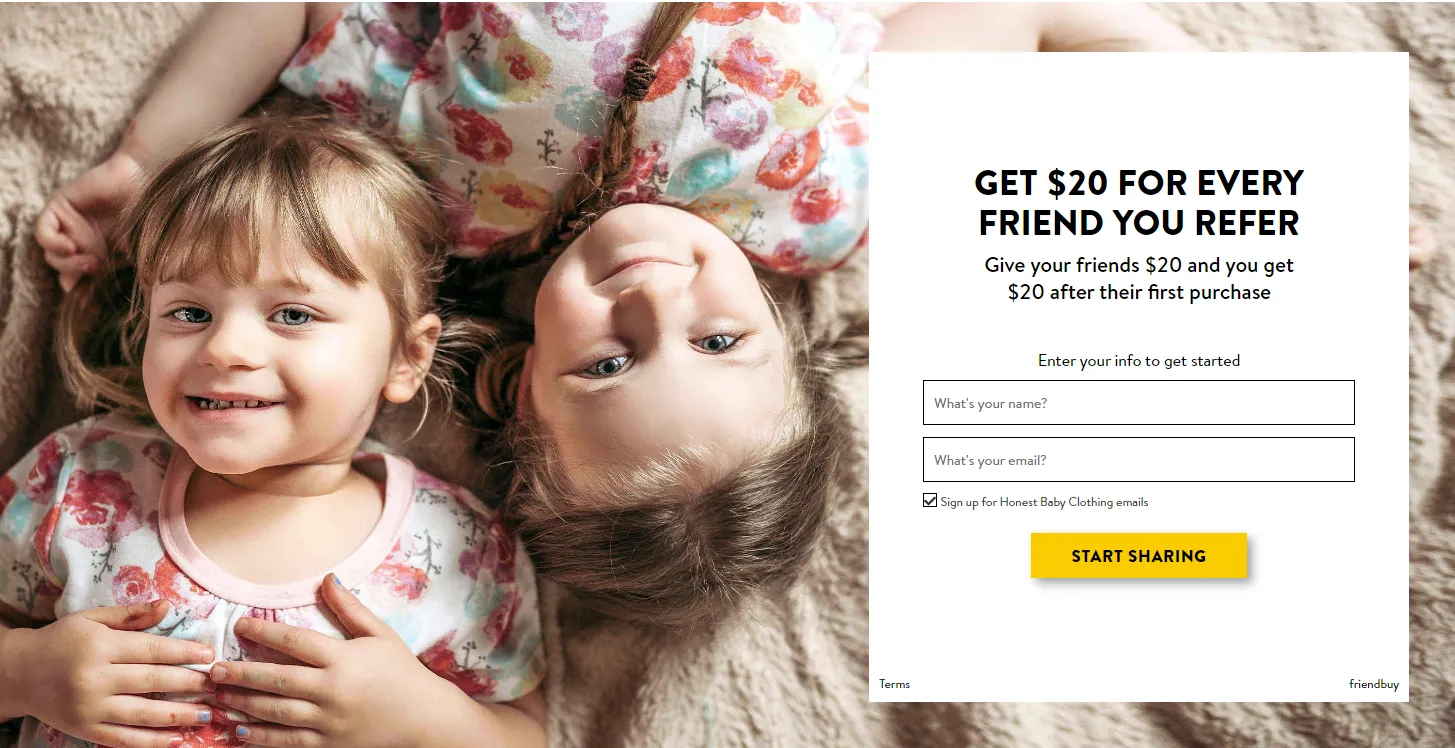 On the left side of the page, there is an image of two blonde girls in white dresses with colorful flowers on them. They are both lying on the ground, smiling, and viewed from a bird's eye perspective. In the foreground, there is a white box of text that promotes the referral program, offering $20 for every referred friend and $20 credit for the friend up to their first purchase. Below the white box, there is a section to enter information to get started, followed by a call-to-action button in orange and yellow that says "Start Sharing.”